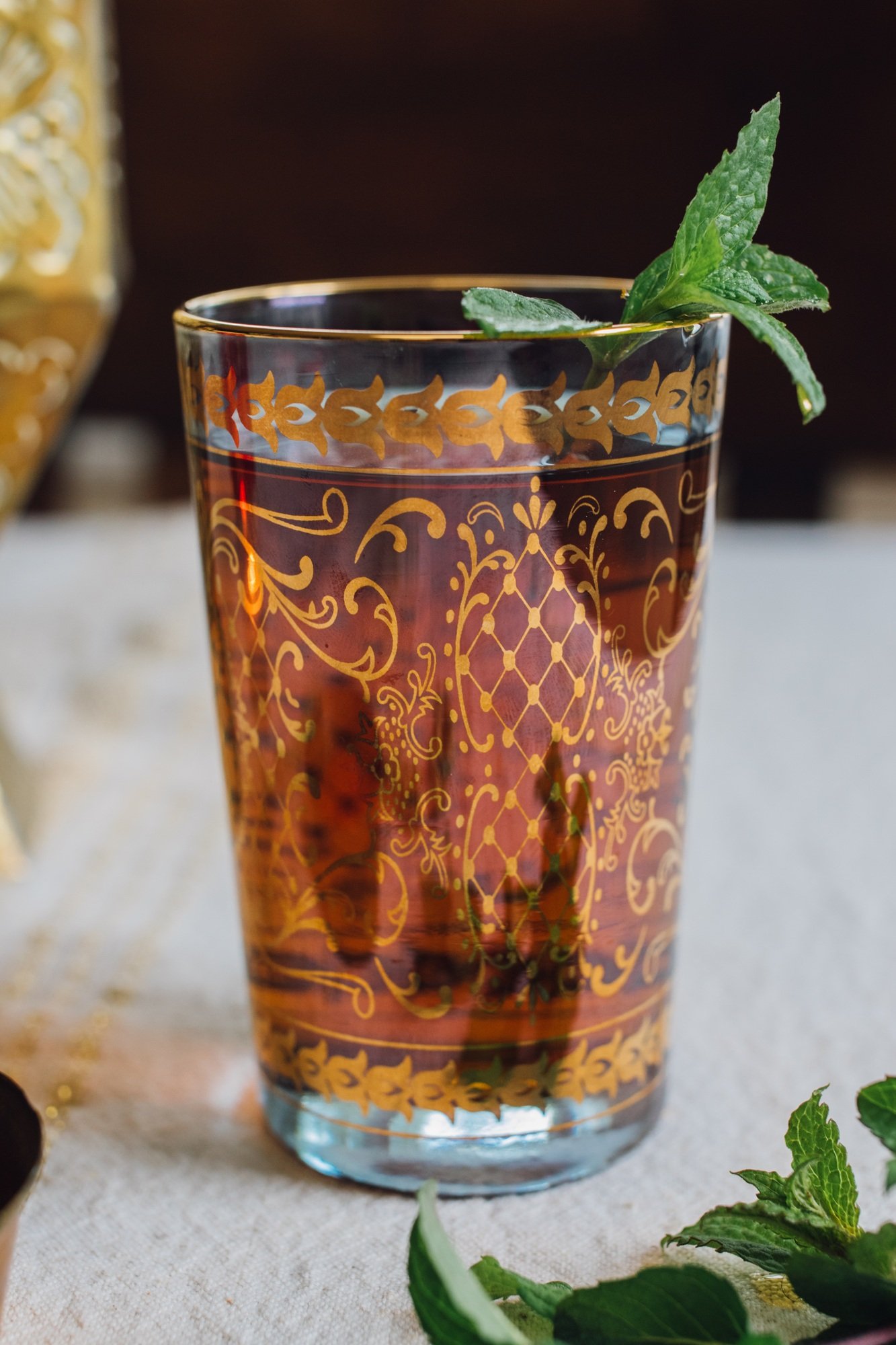 Moroccan mint tea in gold glass Moroccan mint tea in gold glass